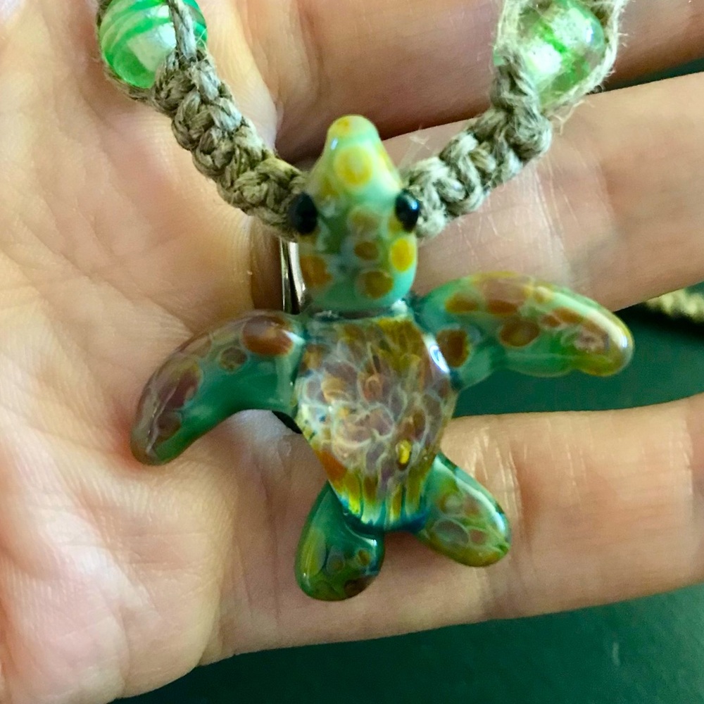 Hand blown glass sea turtle pendant on hemp